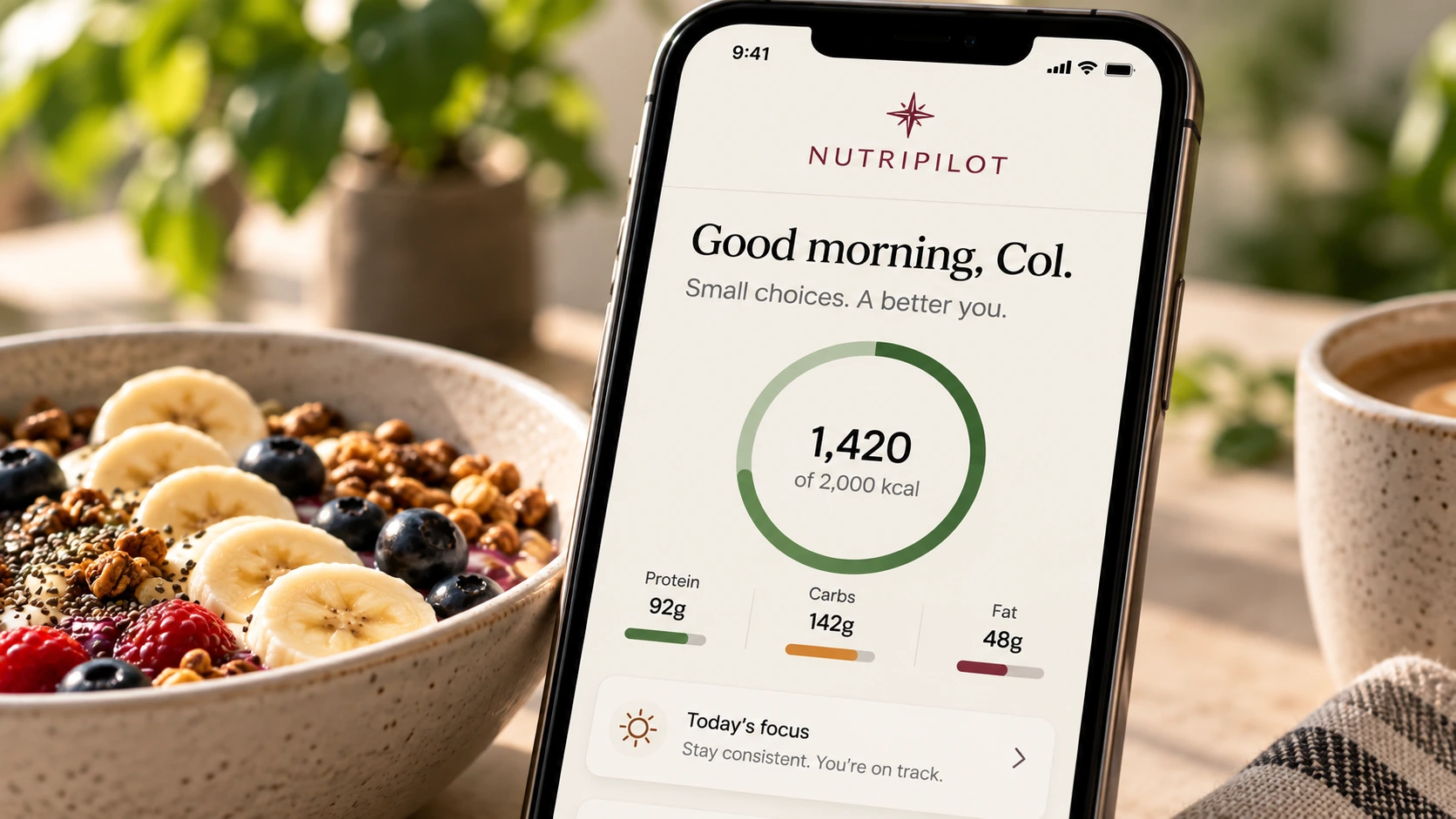 NutriPilot shown on a phone beside breakfast, coffee and a daily notepad